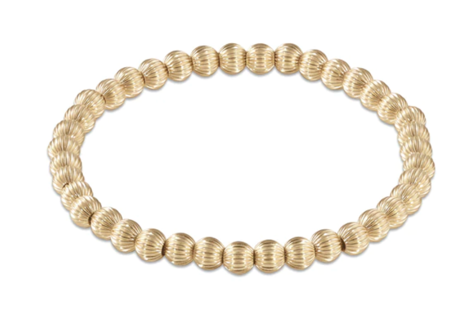 dignity gold 5mm bead bracelet
